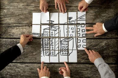 Top,View,Of,Eight,Architects,Or,Urban,Planners,Cooperating,In