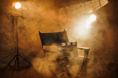 Close,Up,Shot,Of,Cinema,Clapperboard,Standing,On,Director’s,Chair,