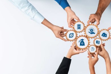 This,Image,Showcases,Hands,Collaborating,Over,Gear,Mechanisms,,Symbolizing,Teamwork
