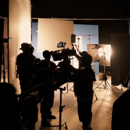 Silhouette,Of,Film,Crews,And,Video,Camera,On,Special,Dolly